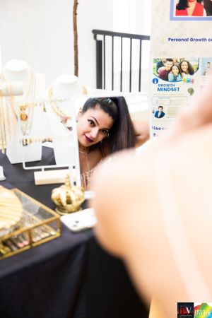 A behind-the-scenes photo showing decorative items on a table at an event setup.