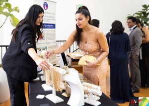Event attendees browse merchandise displays at a pop-up shopping event.