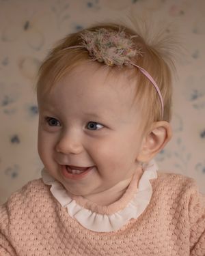 A baby girl giggles