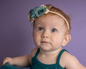 A baby girl looks up