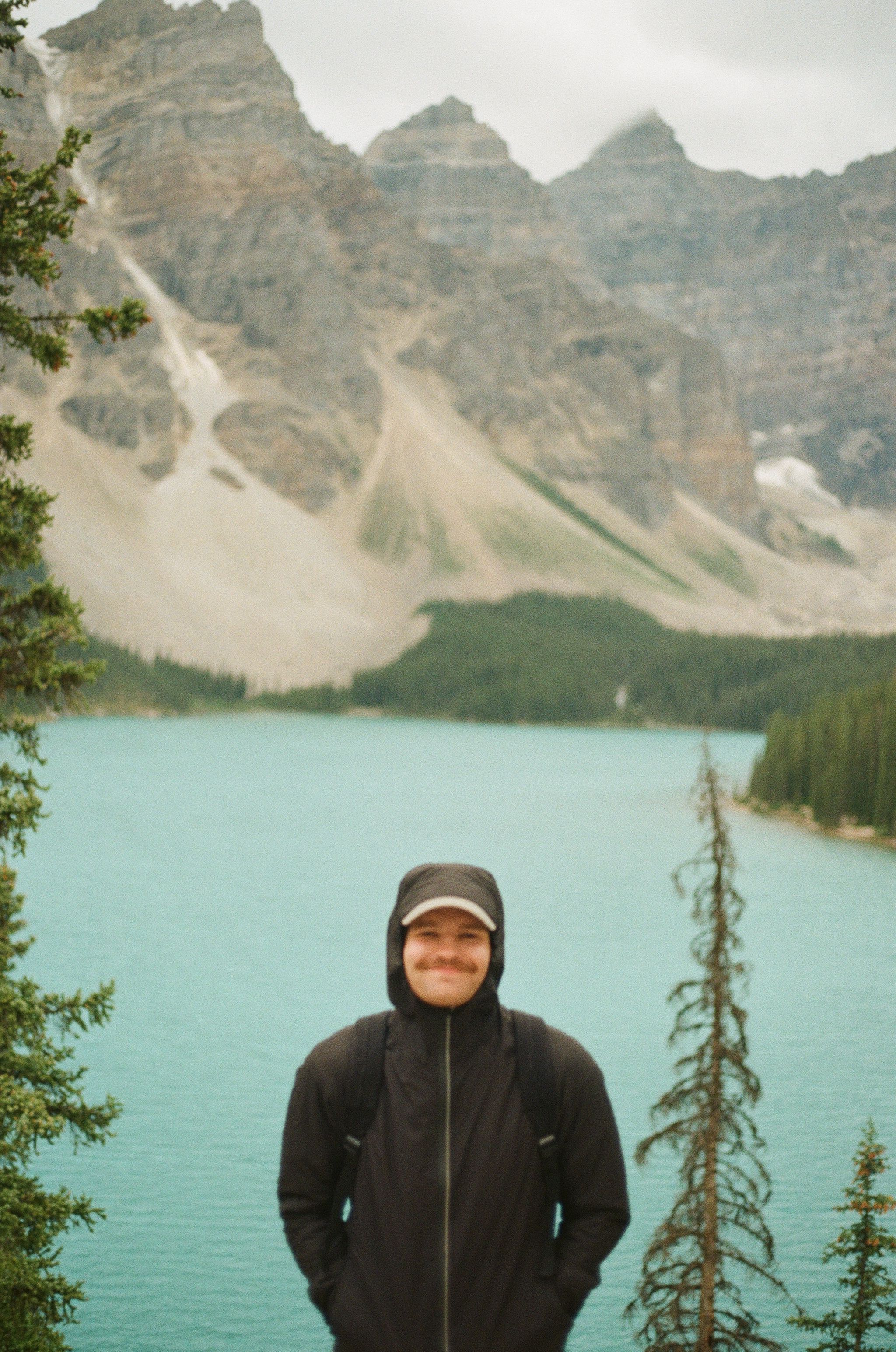 A photo of me on film standing in front of Moraine Lake in Banff Canada
