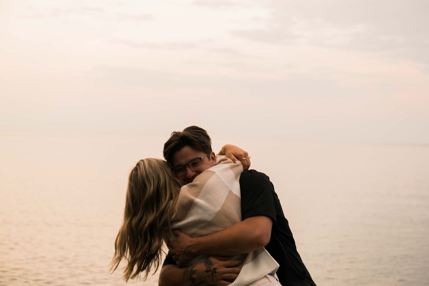 The moment after a proposal at Split Rock Lighthouse in Duluth Minnesota
