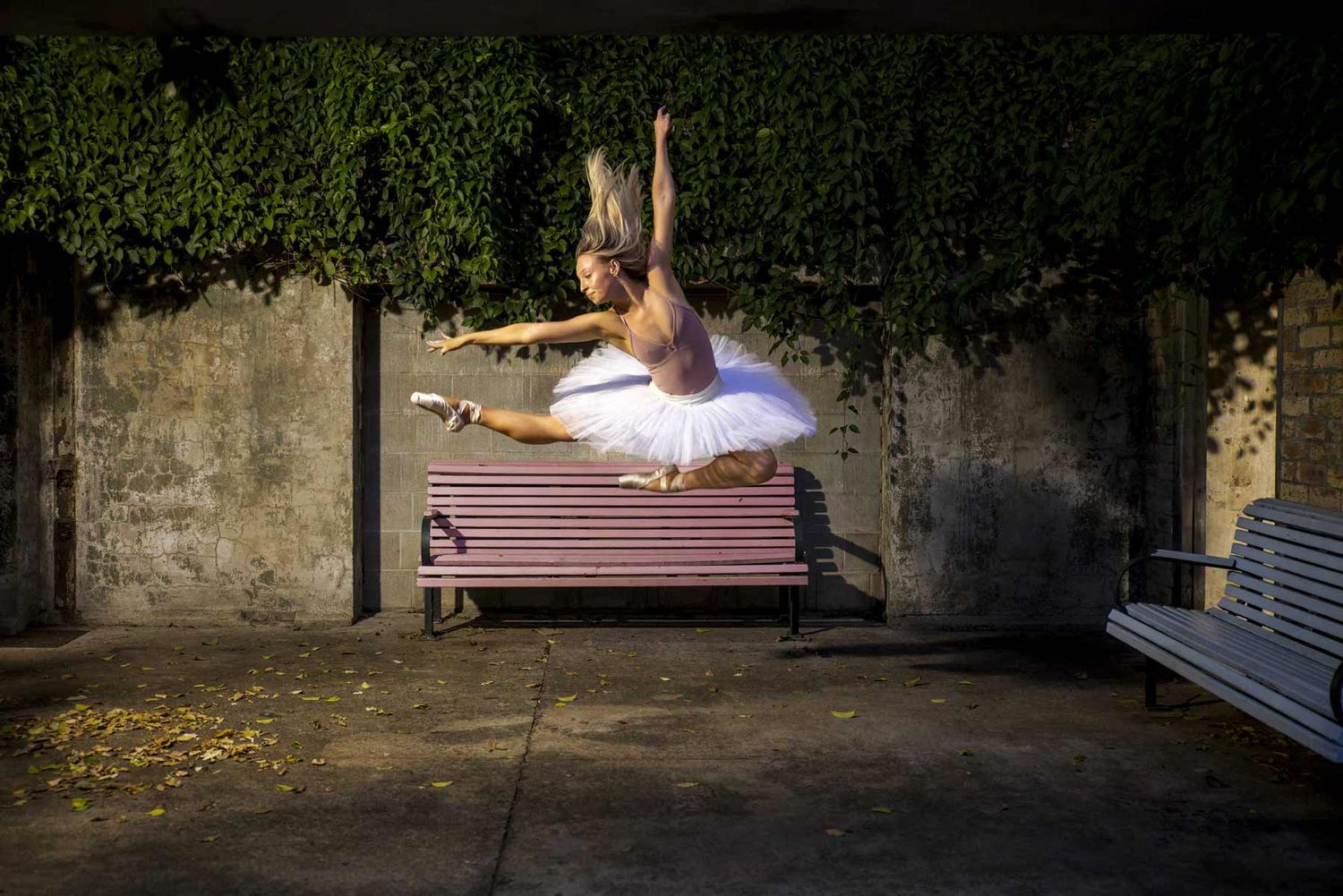 Alisha gracefully leaps through the air, captured by Nick Wigmore dance photography.