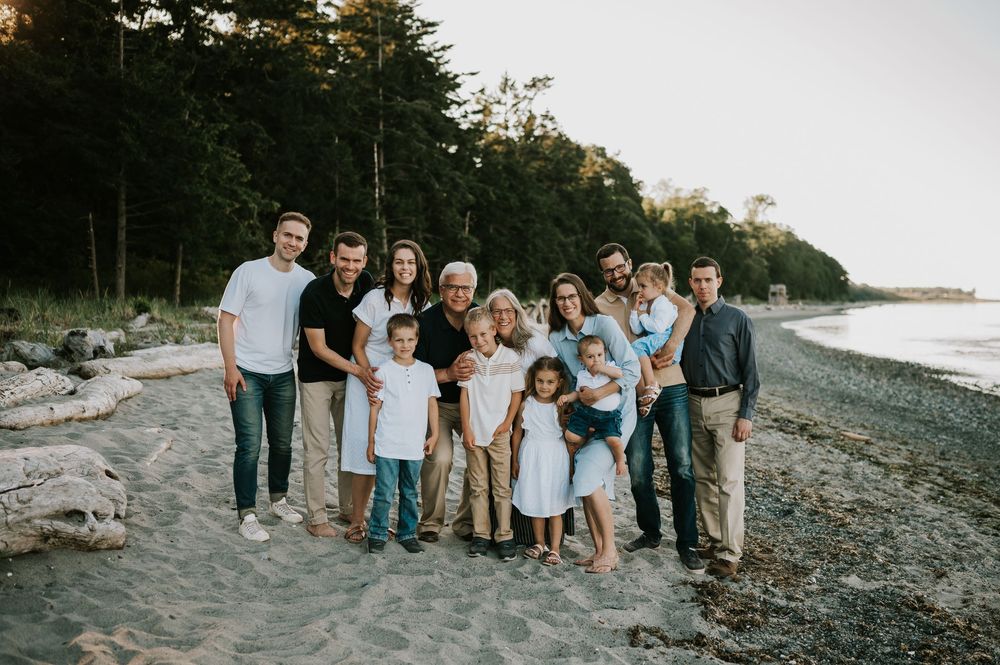 Extended family photo smiling & standing on Kye Bay beach Comox Valley Vancouver Island Photography by Photographer Soulfull Photographs