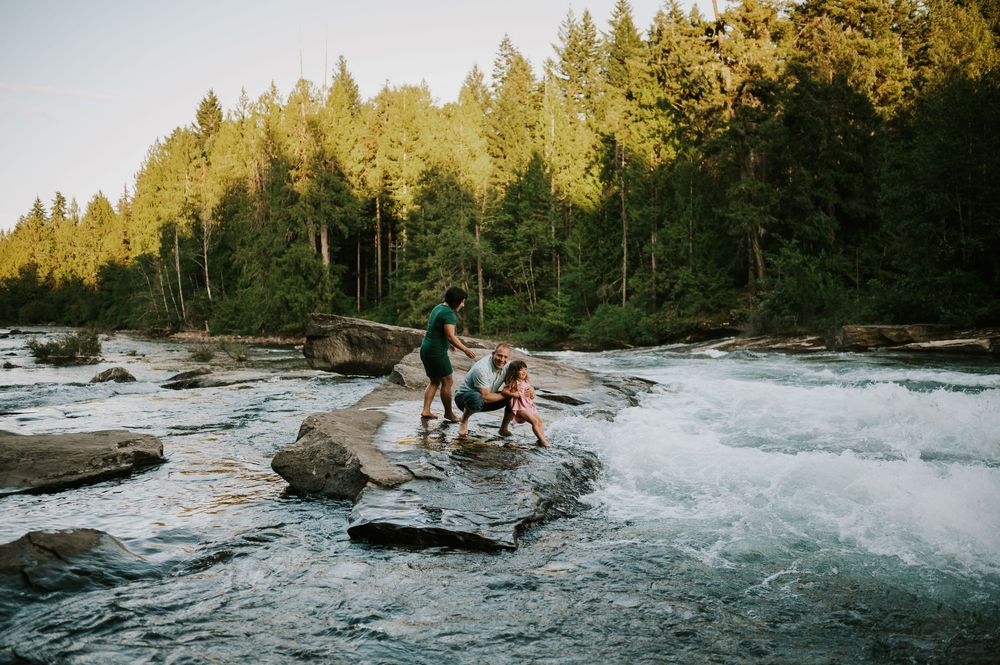 Family photoshoot of family walking on rocks by Nymph Falls Comox Valley Vancouver Island Photography by Photographer Soulfull Photographs