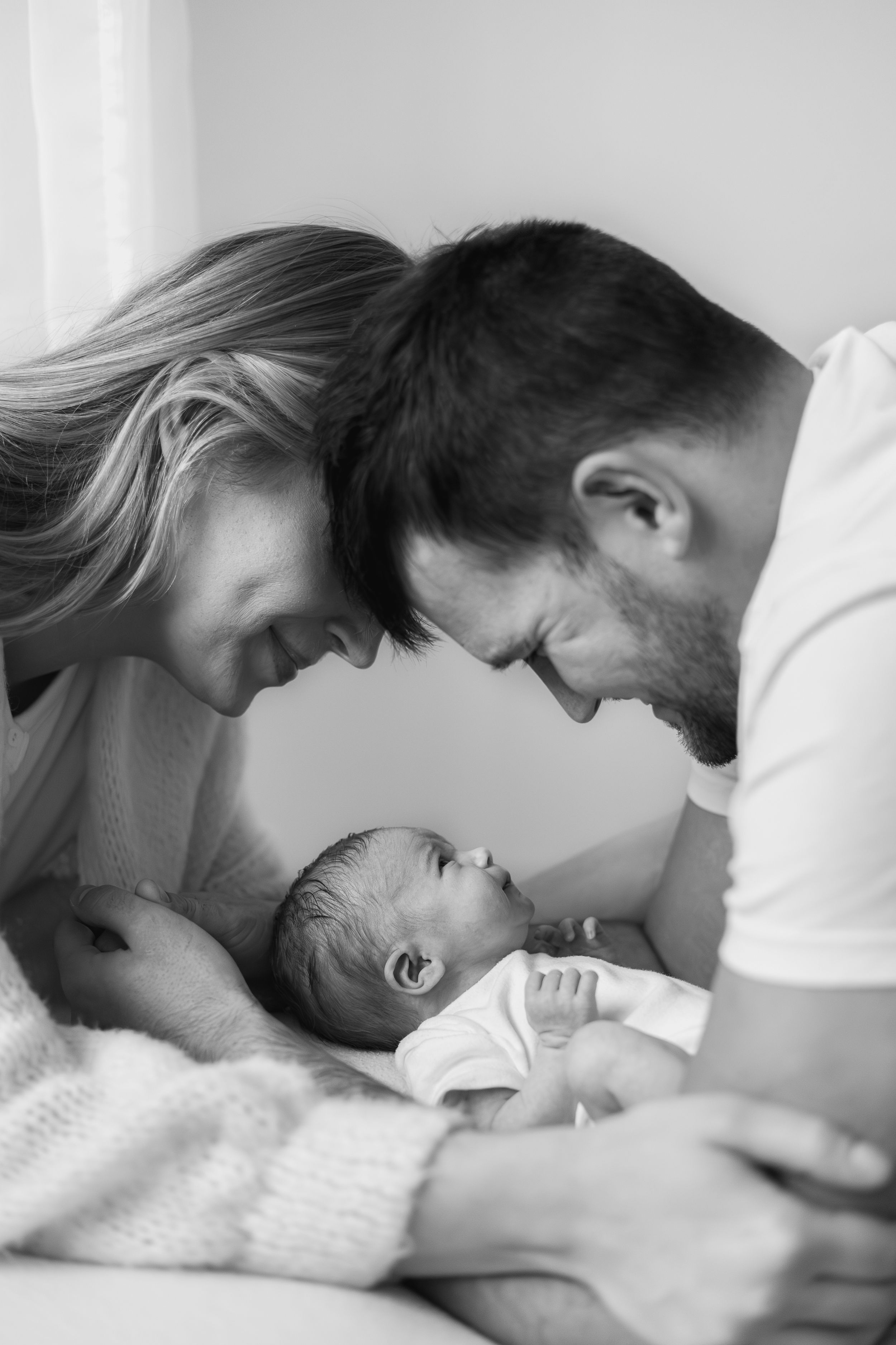 Newborn photoshoot Nottingham natural light baby with parents portrait cosy studio