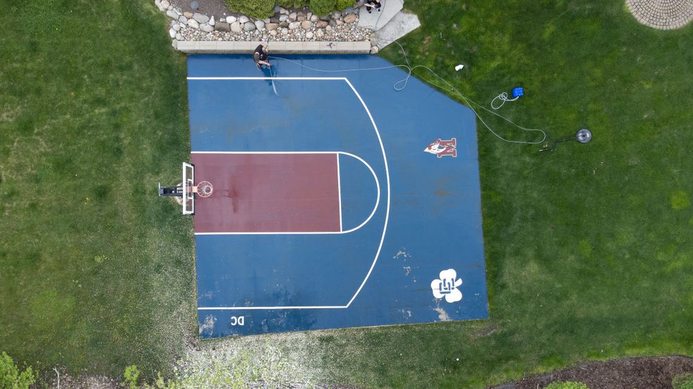 A top down view of a half basketball court