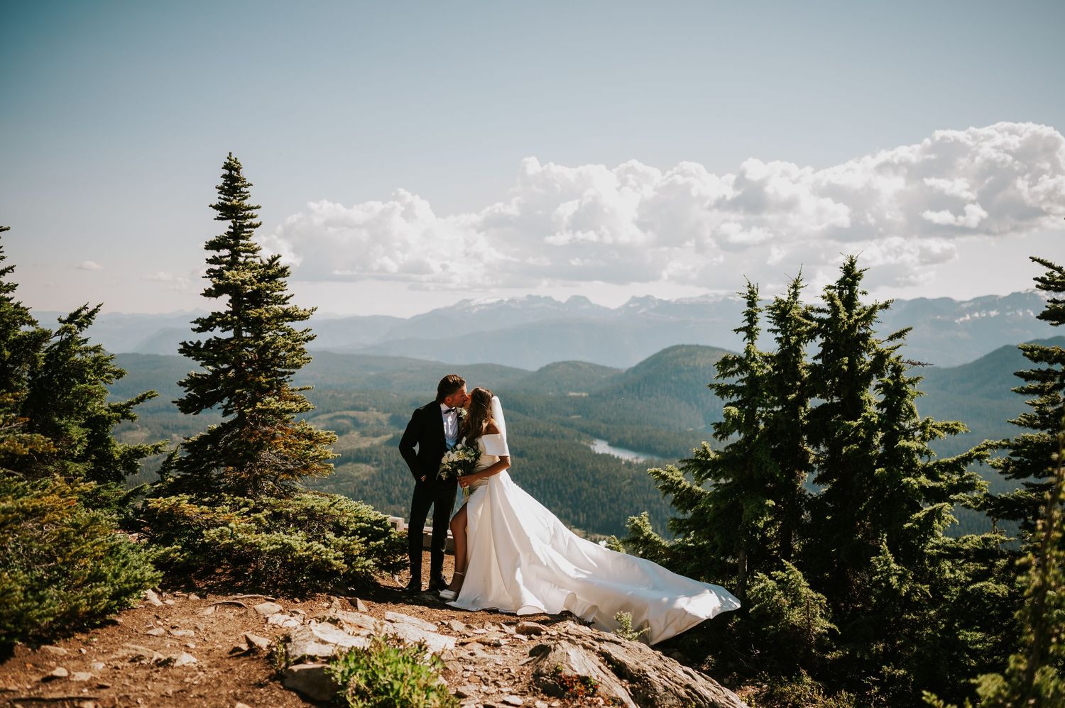 Wedding portrait of couple on Mt Washington in front of mountains photography by photographer Katie in Comox Valley Vancouver Island