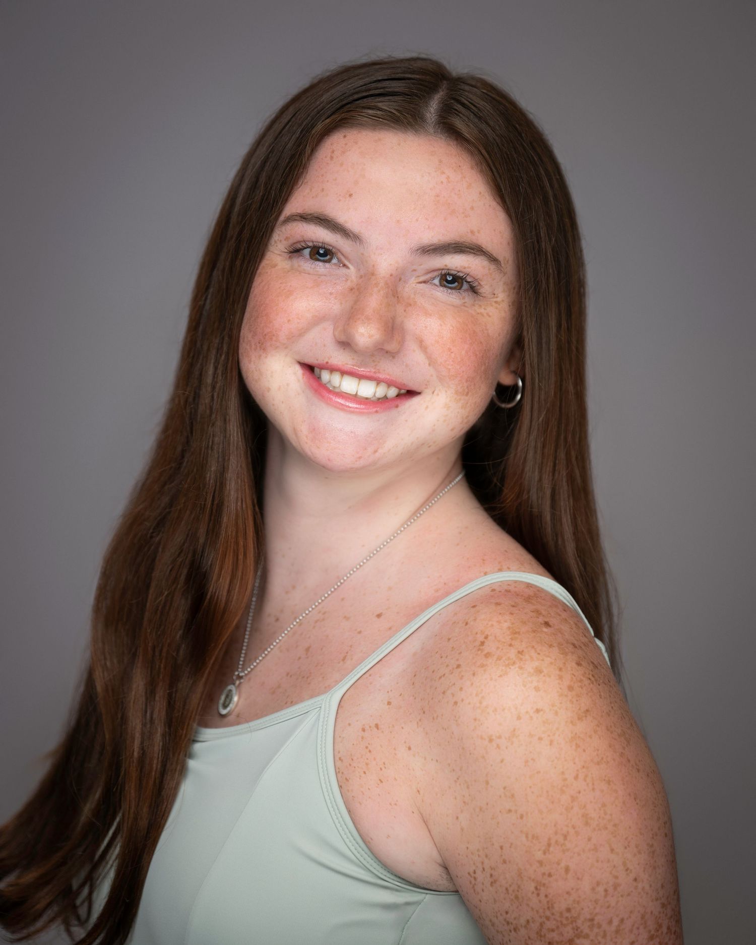 Studio portrait with soft lighting against grey background.
Pittsburgh Dance Photographer