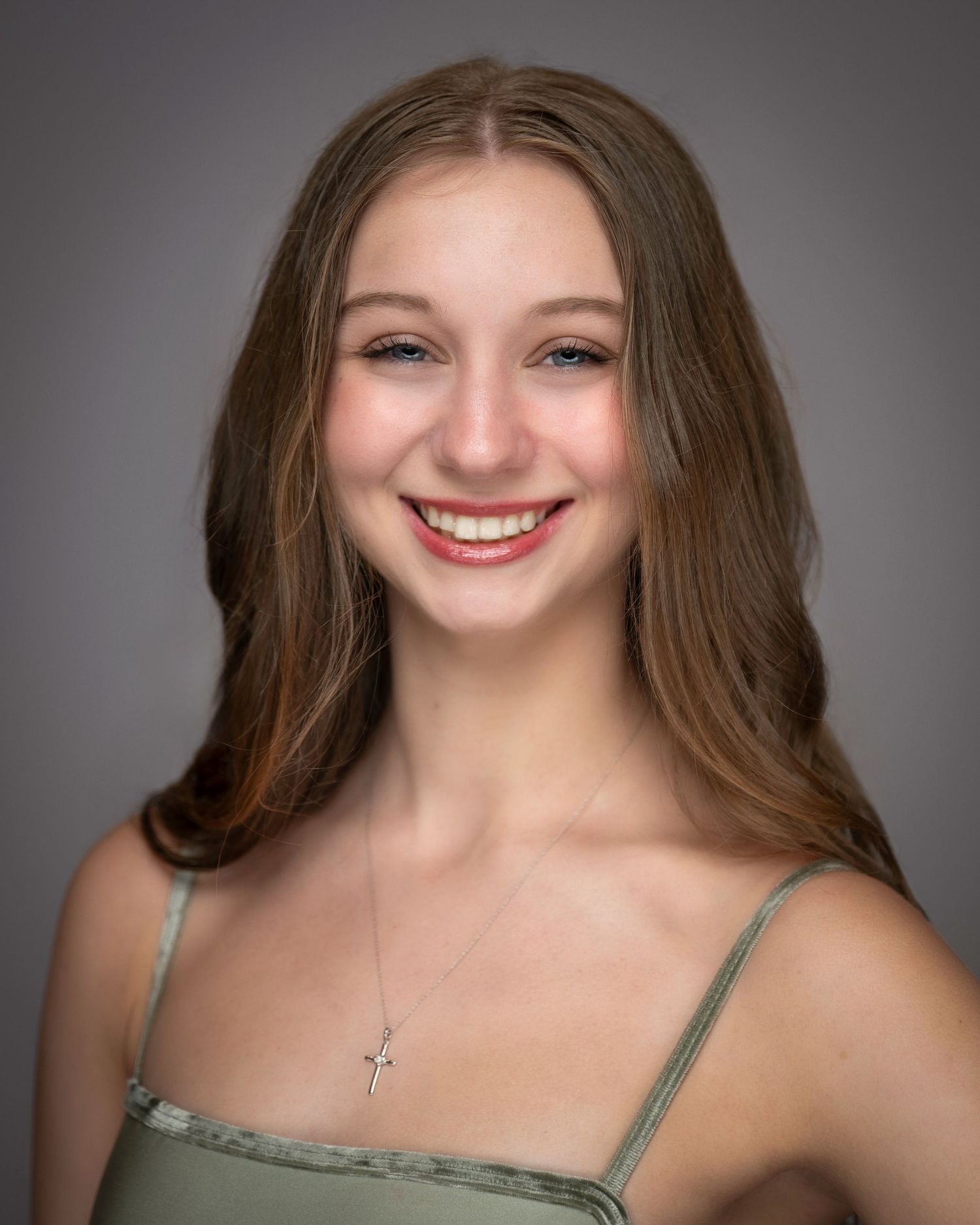 Studio portrait of dancer in olive camisole with natural makeup and flowing brown hair.
Pittsburgh Dance Photographer