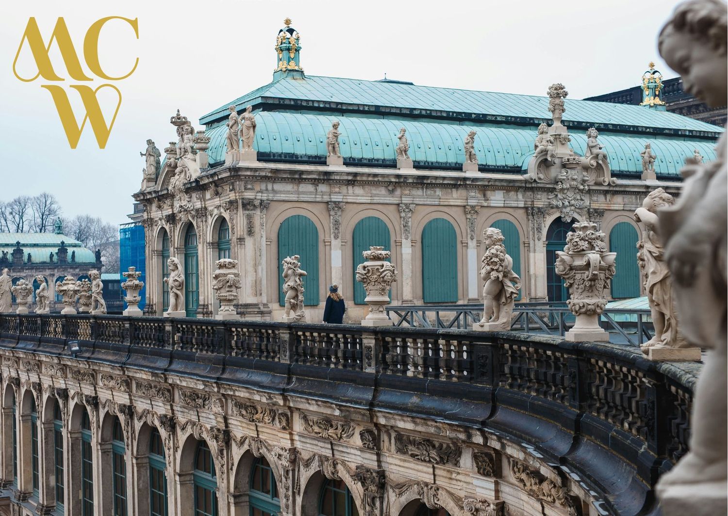 Baroque architectural details of Dresden Zwinger palace with sculptures and ornate decorations.