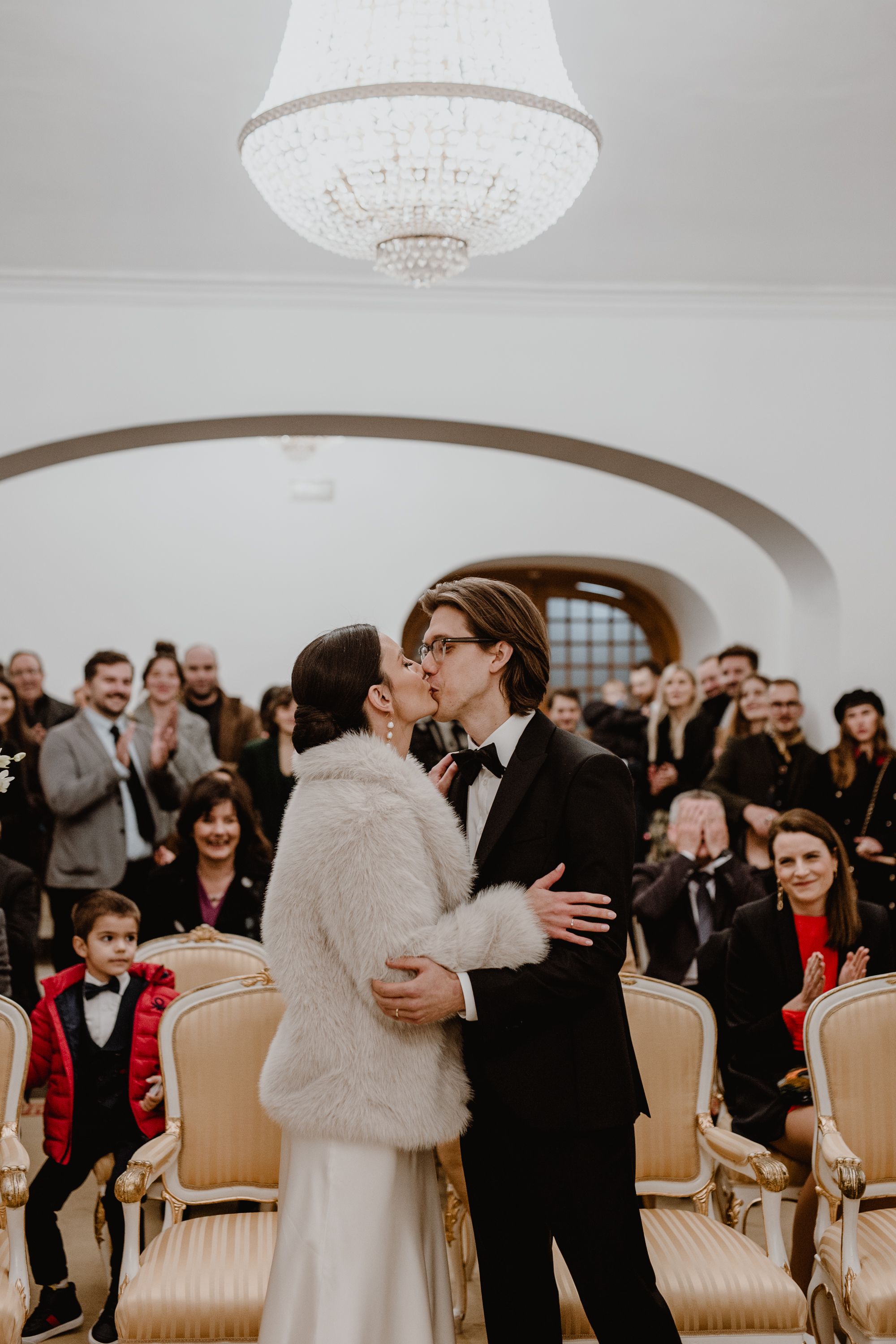 The bride and groom seal their vows with a celebratory kiss following their ring exchange at the Registrar's Office.