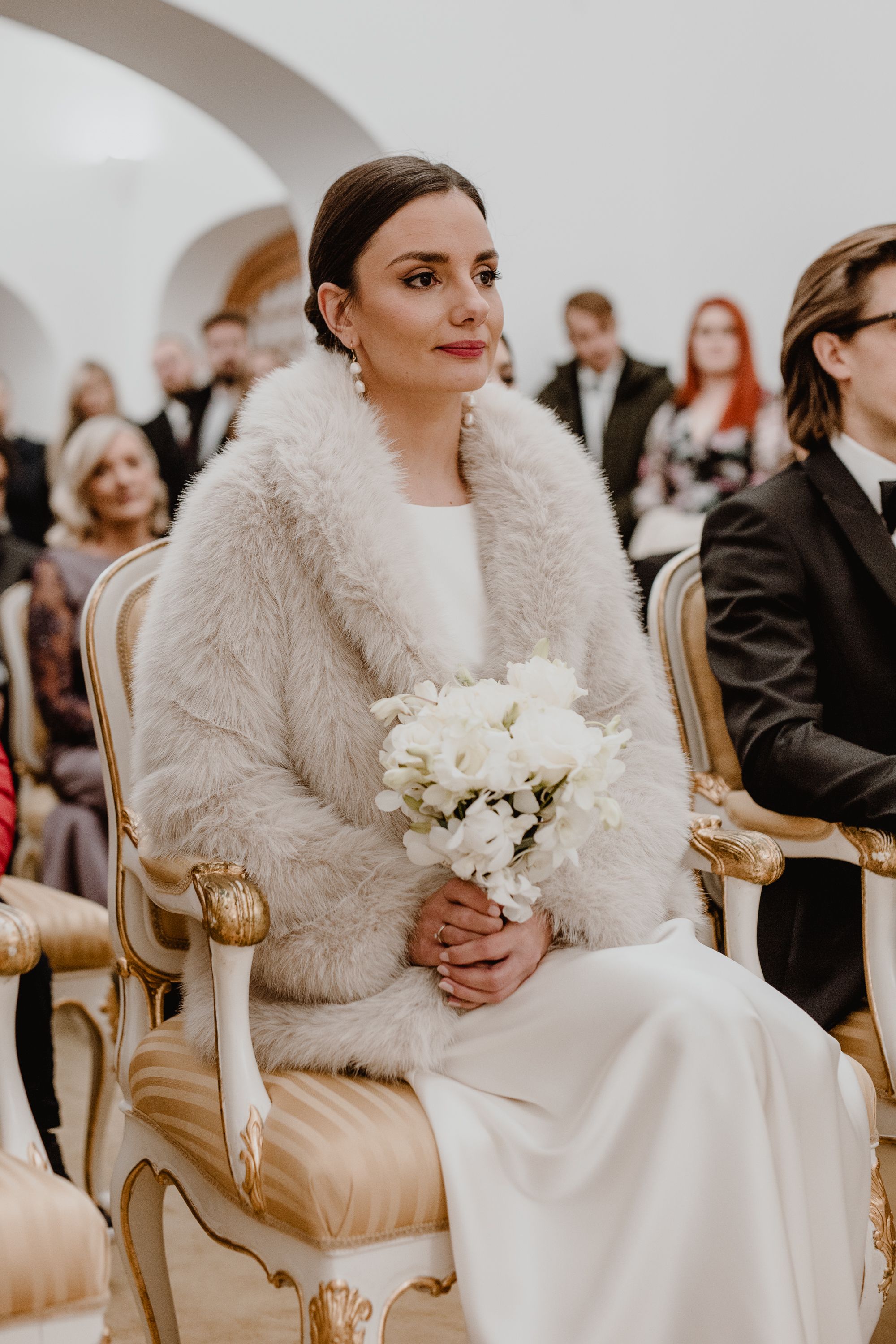 Portrait of a bride sitting in registars office during wedding ceremnoy in upper town in zagreb.