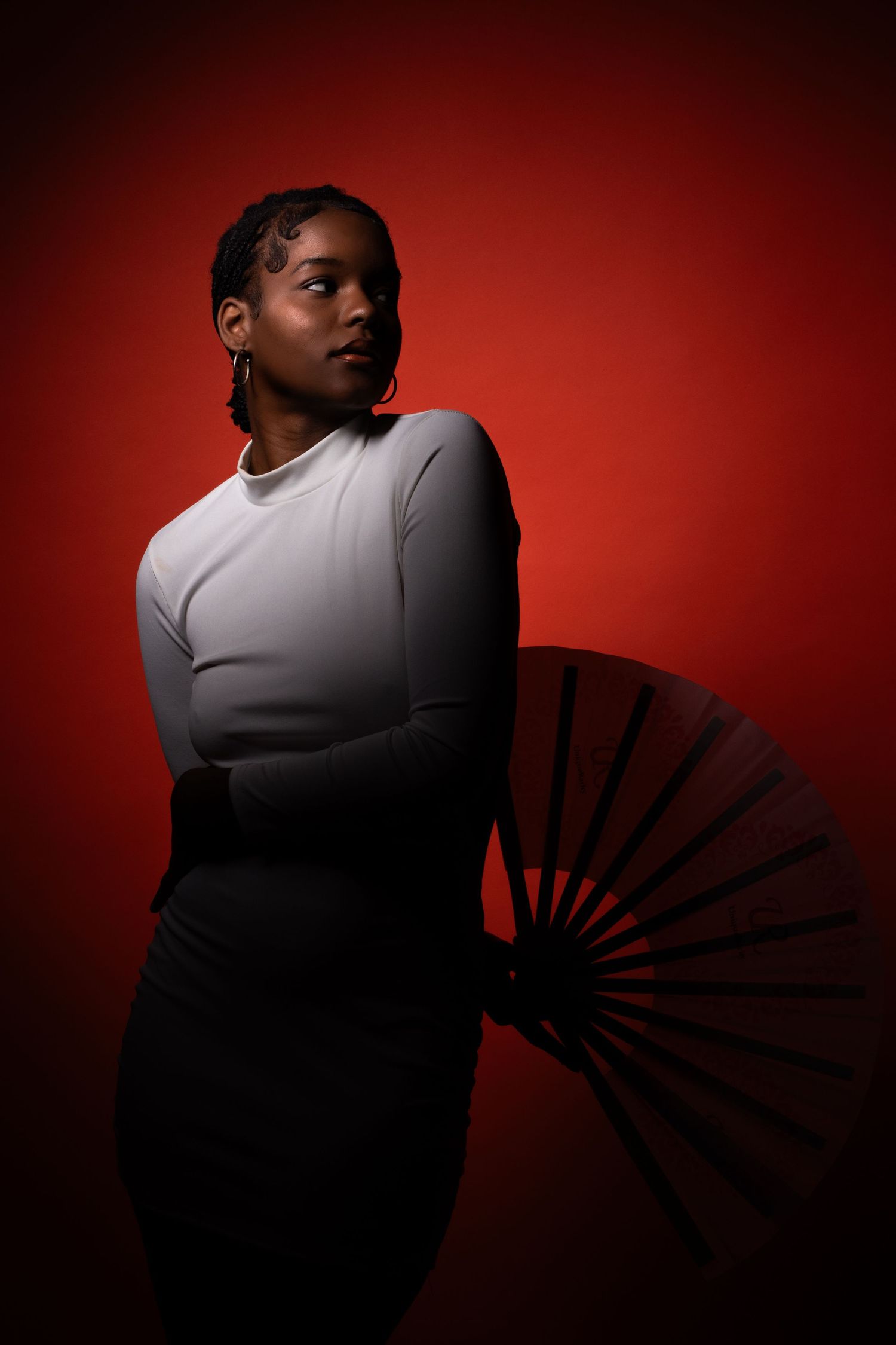 Studio portrait of a model dressed in Mardi Gras attire, captured by Meaghan Doggett Photography in Mobile, Alabama.