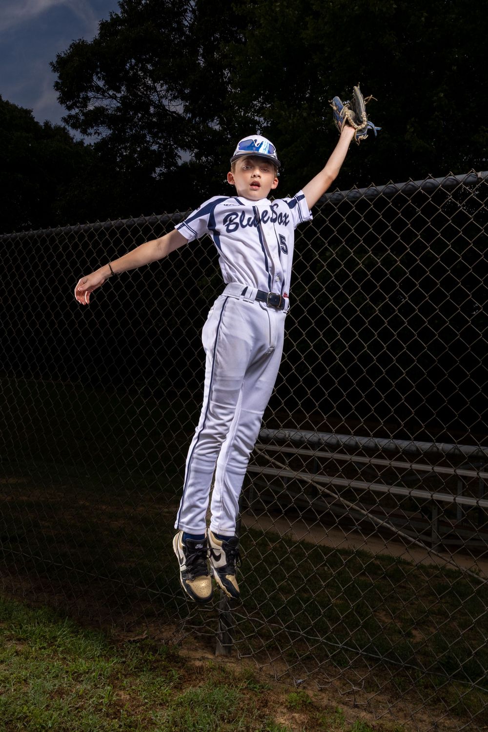 baseball outfielder jumping for ball suzi gibson photography dramatic sportraits sport portraits senior baseball maryland dmv smoke fog