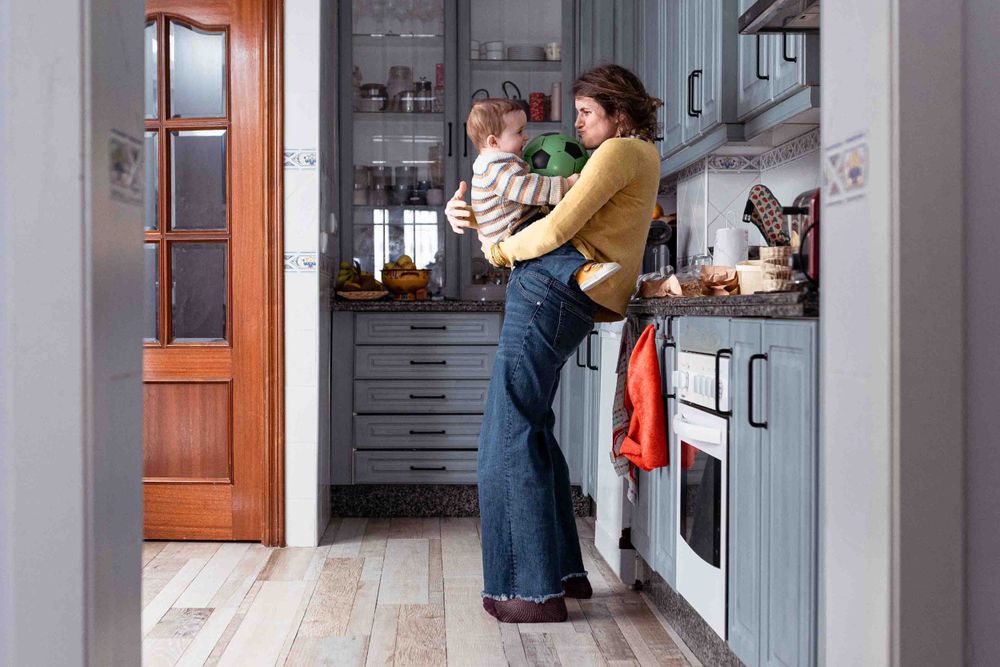 A cozy kitchen scene with warm lighting and wood floors.
