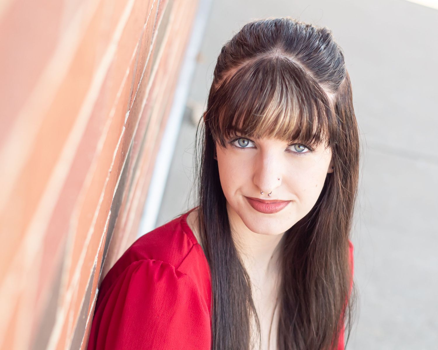 Portrait series with soft lighting against white background.