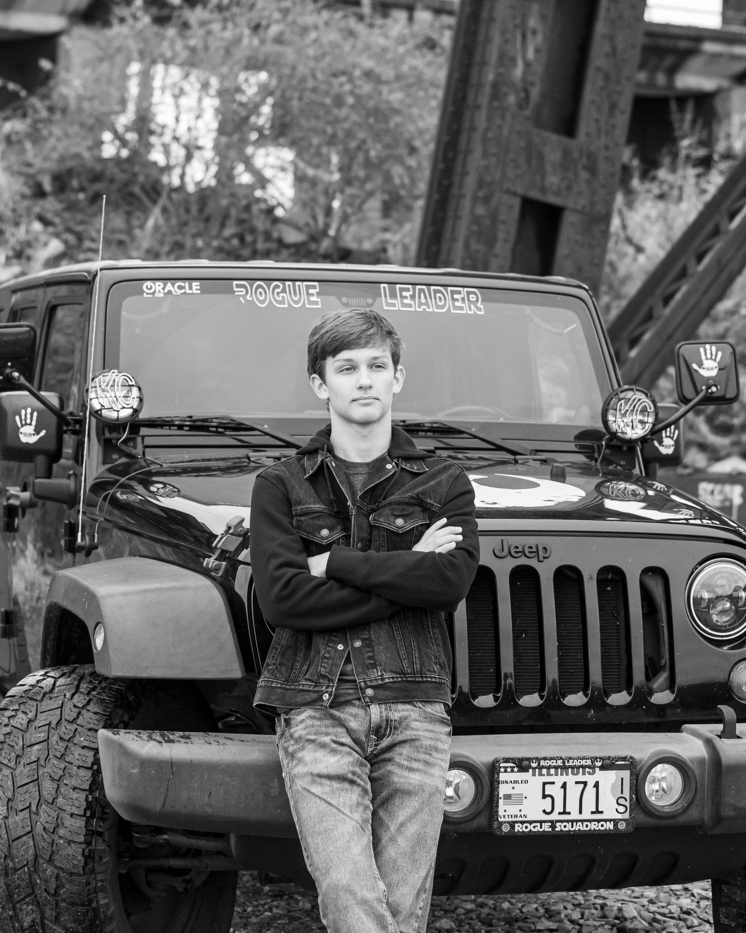 Black and white portraits with classic Jeep in background.