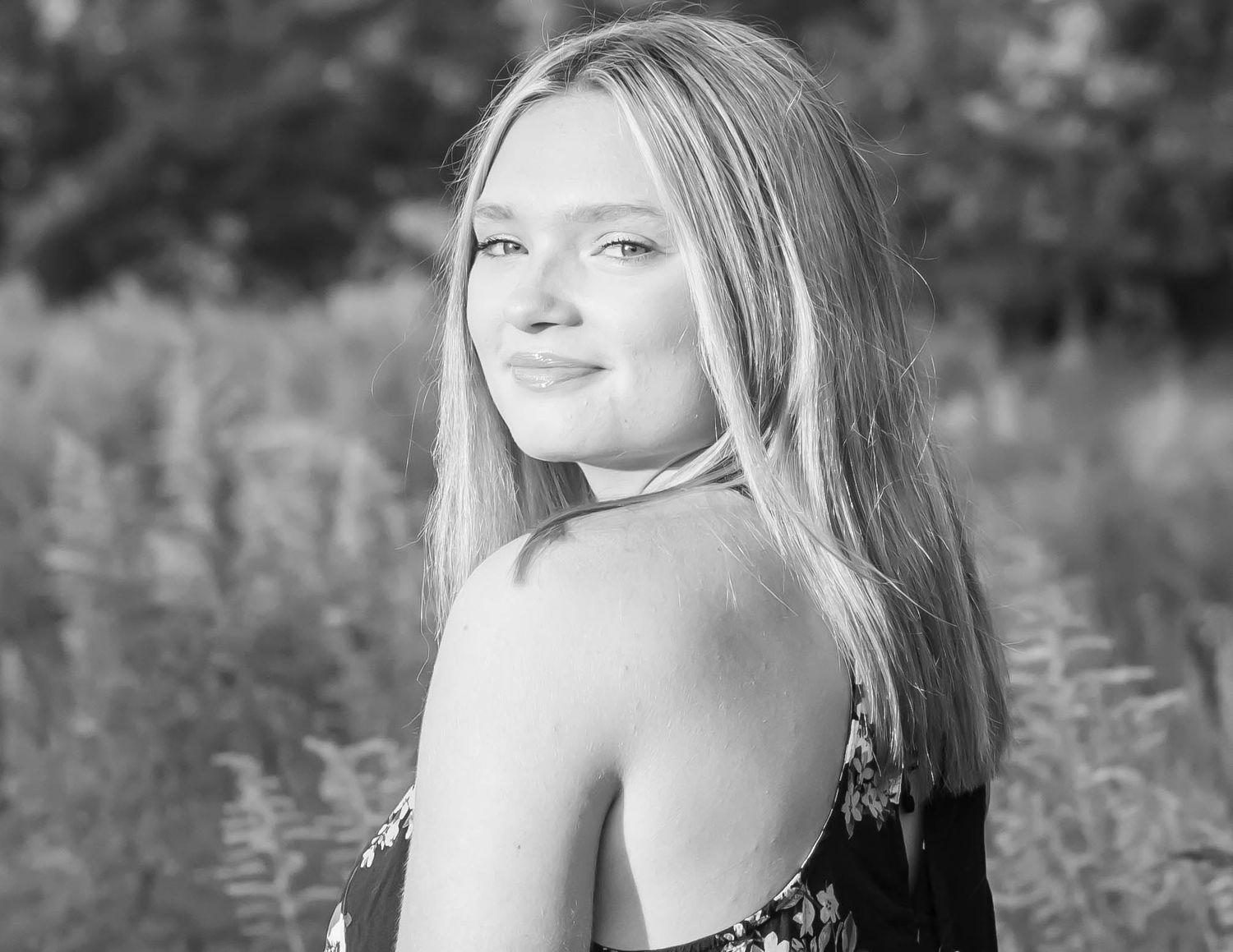 Black and white outdoor portrait series in natural setting.