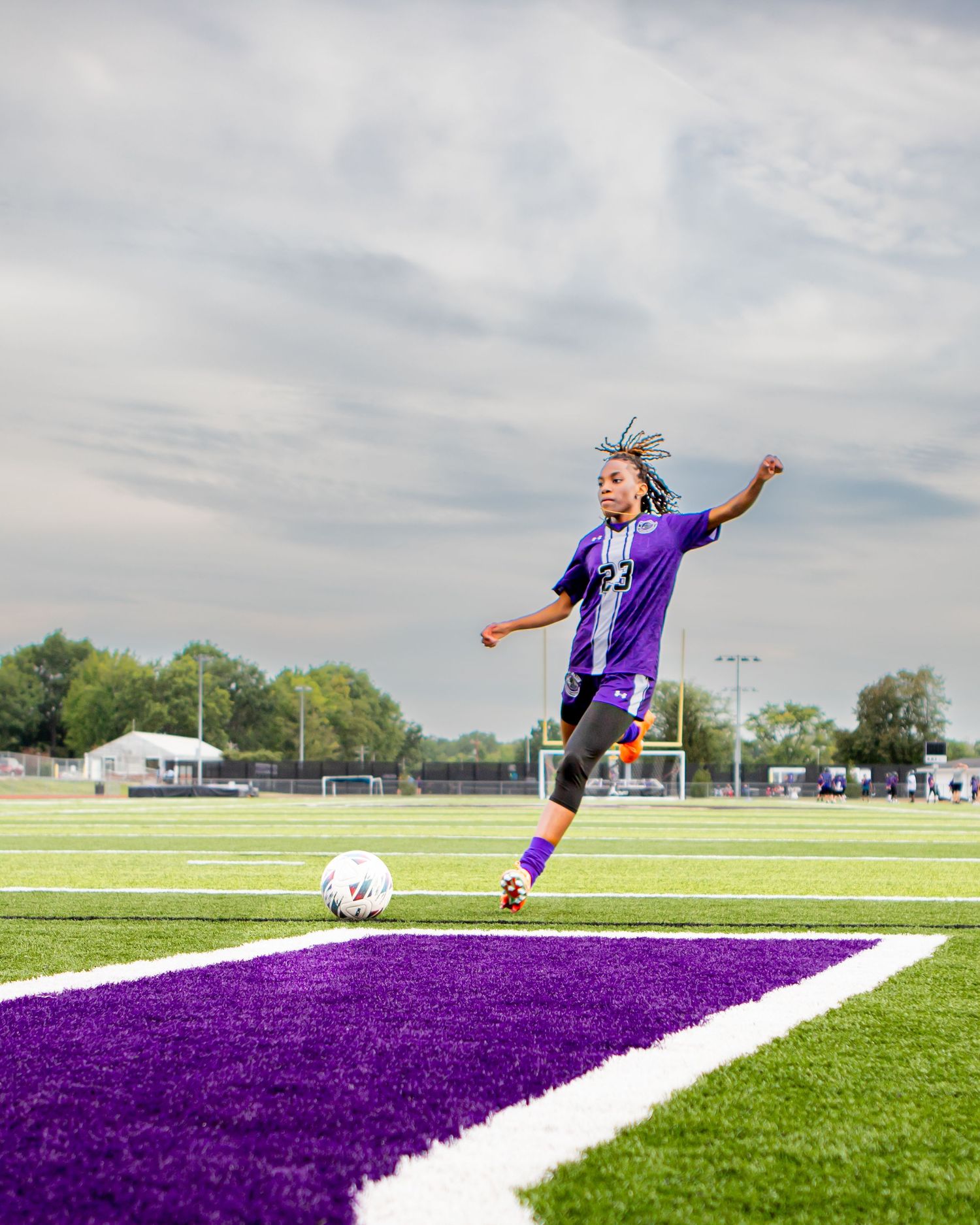 Athletic action shots on a purple and white sports field showing dynamic movements.