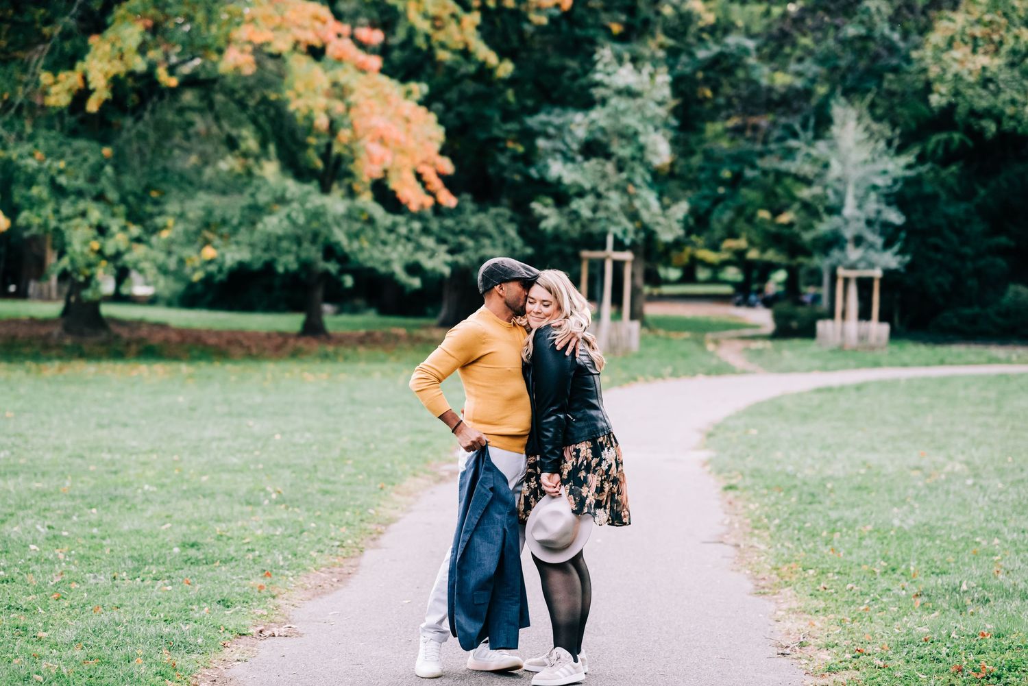 Couple kissing at park Perle du Lac in Geneva Switzerland