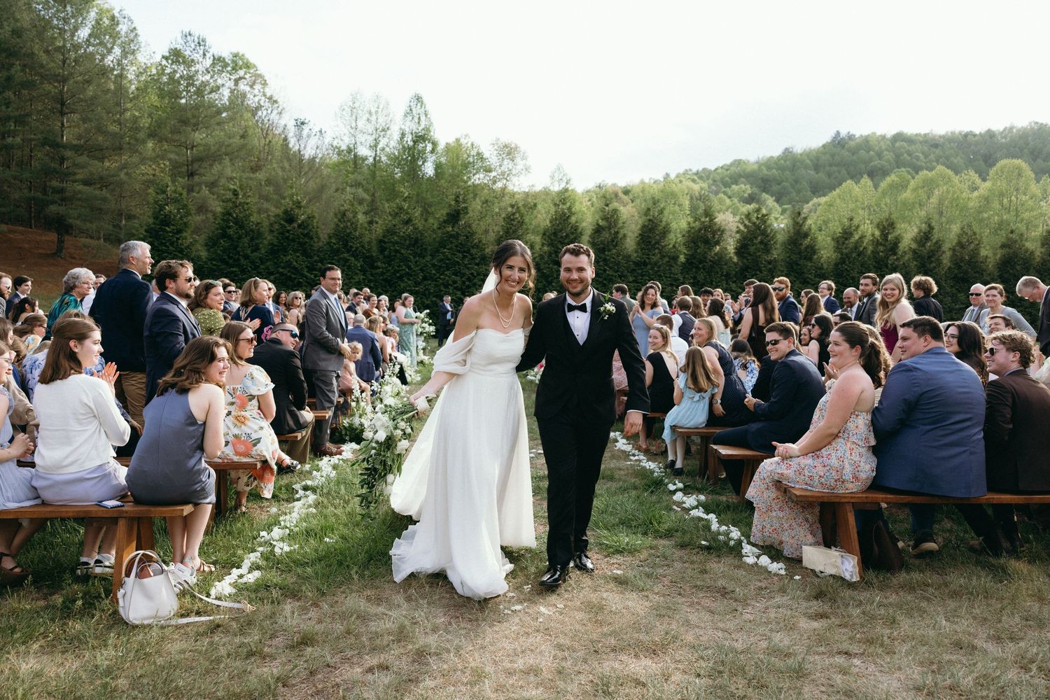 Elegant outdoor wedding photos taken in a lush green garden setting. Luxury Estate Wedding Photographer in NC