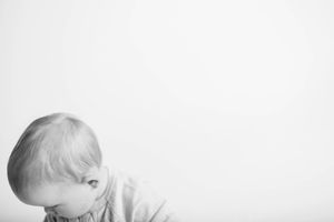 Close-up black and white portrait showing gentle tenderness and connection.