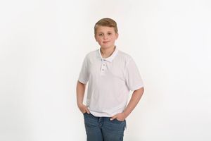 Person in white polo shirt and blue jeans standing against white background.