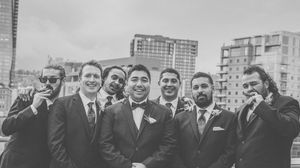A large group of people gathered outdoors in a vintage black and white photograph from a formal event.