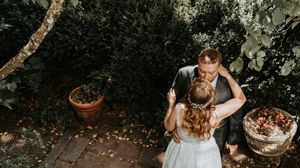 A collection of fall wedding photos showing romantic moments and autumn decor in an outdoor woodland setting.