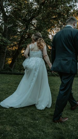 A sequence of wedding photos capturing the couple walking through a grassy outdoor setting at sunset.