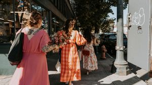 A collage of wedding photos showing outdoor venue details, floral arrangements and candid moments at a rustic celebration.