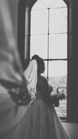 A black and white sequence of silhouetted figures dancing in front of bright windows creates a dreamy motion effect.