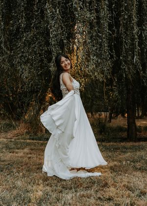 Ethereal white dress movement captured in a series of romantic woodland photos at sunset.