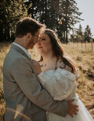 A romantic golden hour moment captured in a rustic outdoor setting.