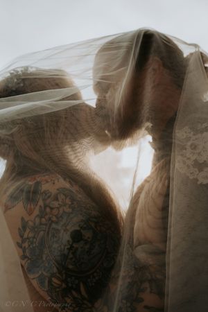 A sepia-toned artistic photo sequence showing silhouettes with tattoos in overlapping poses.