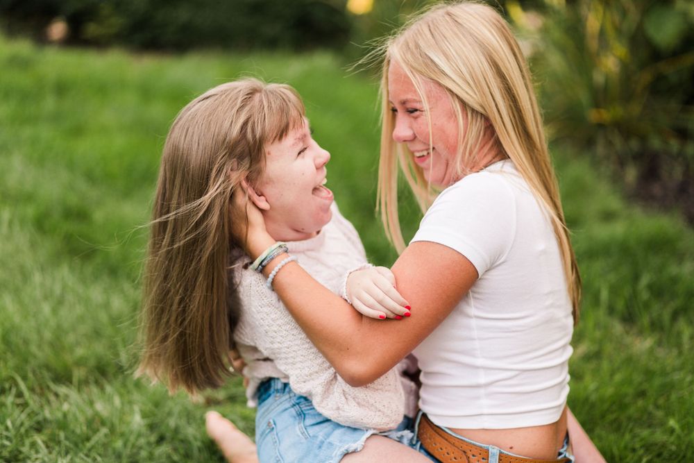Oxford Michigan Senior Session. Natural light outdoor session. Twin sisters get together in senior candid portraits.