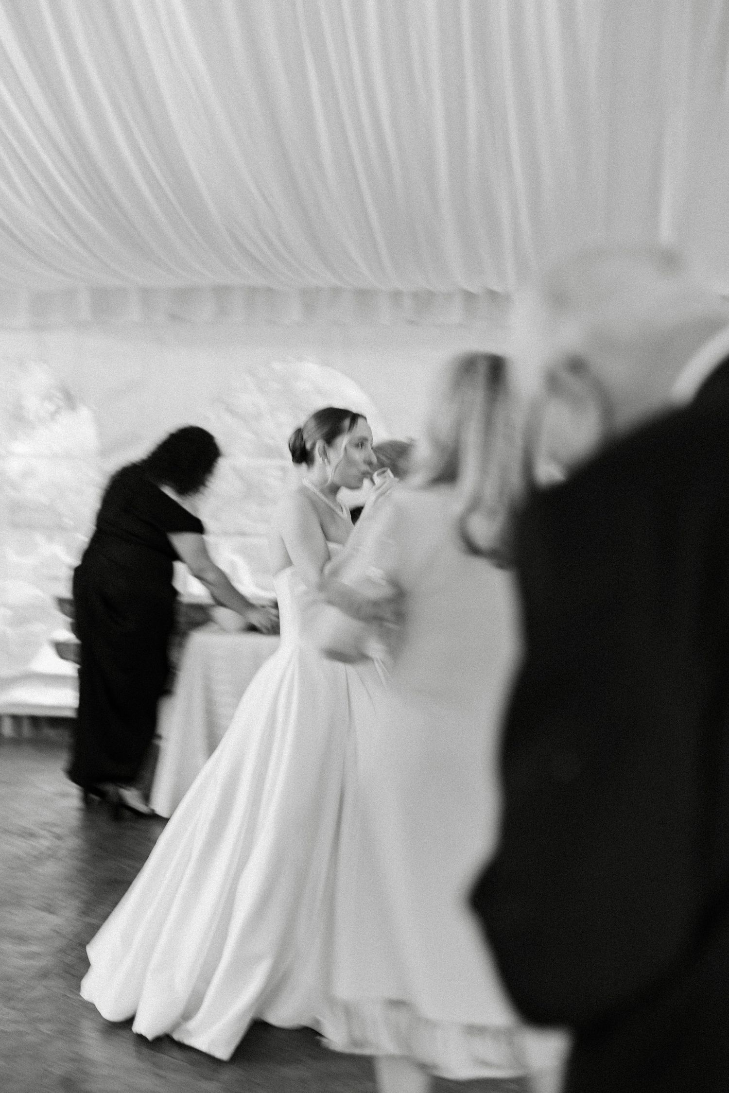 Bride and groom share an intimate first dance at their elegant wedding reception.