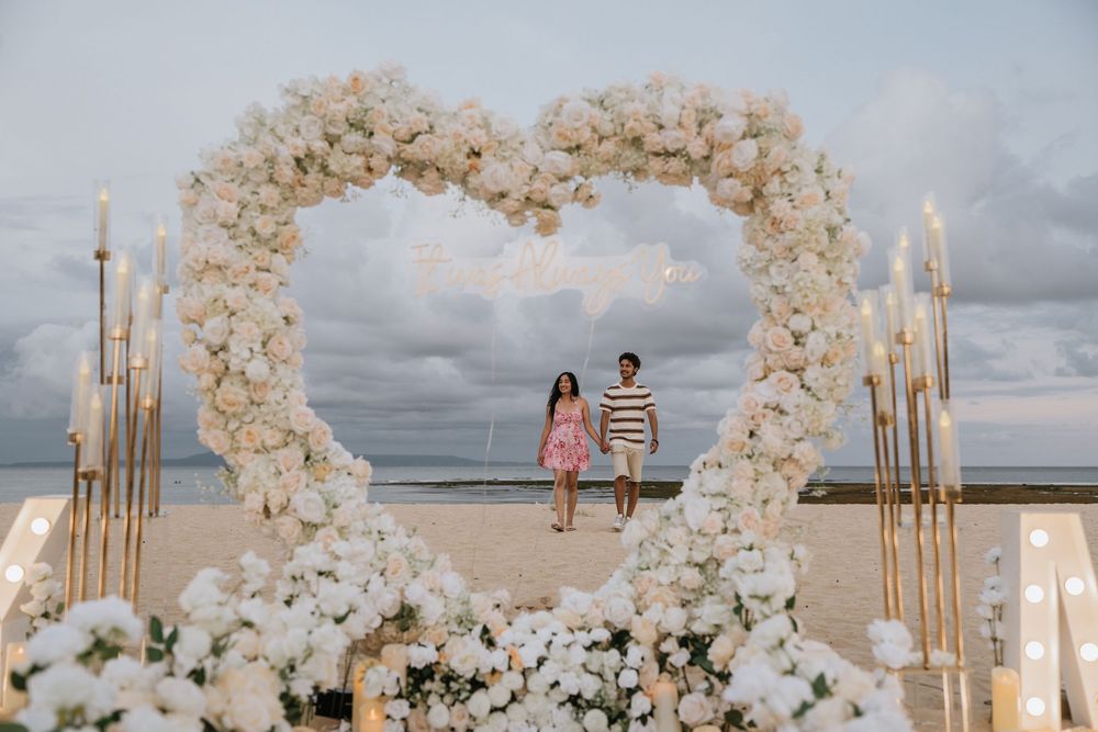 Luxury proposal photography experience at Mengiat Beach.