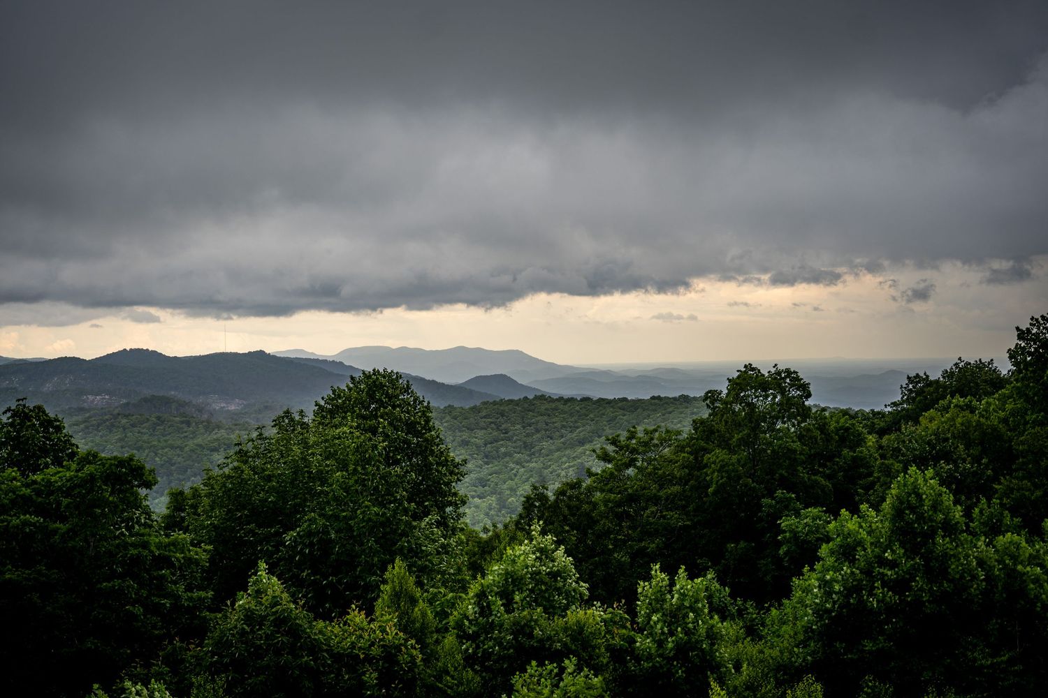Sassafrass Mountain Overlook. Stormy sky over lush green Appalachian mountain forest of South Carolina with dark clouds rolling in.