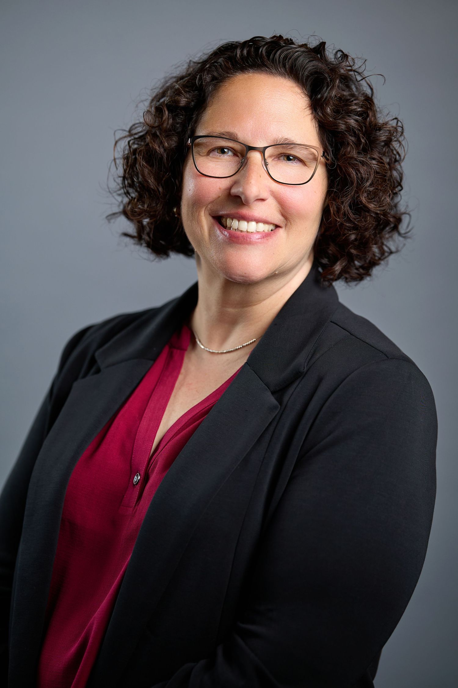 A woman sits for a headshot in Appleton Wisconsin.