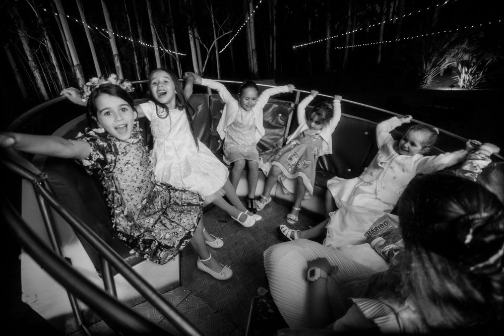 Energetic crowd having fun on a dance floor at a nighttime party.