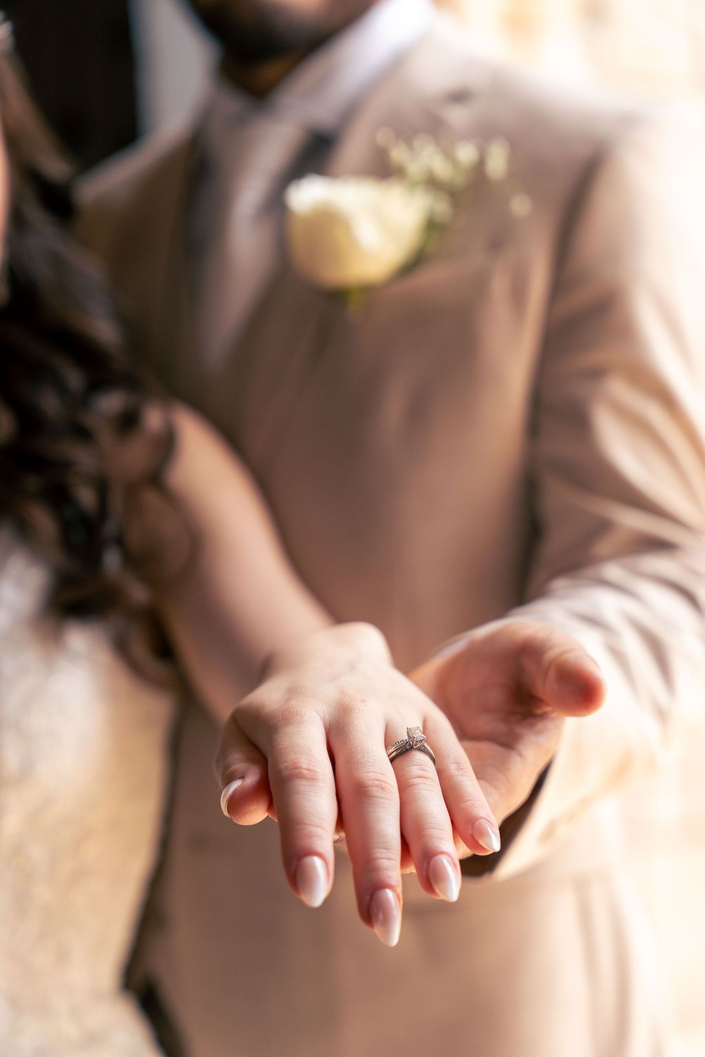 Bride showing her engagement ring during a wedding portrait, photographed by Miami wedding photographer OkataStudio.
