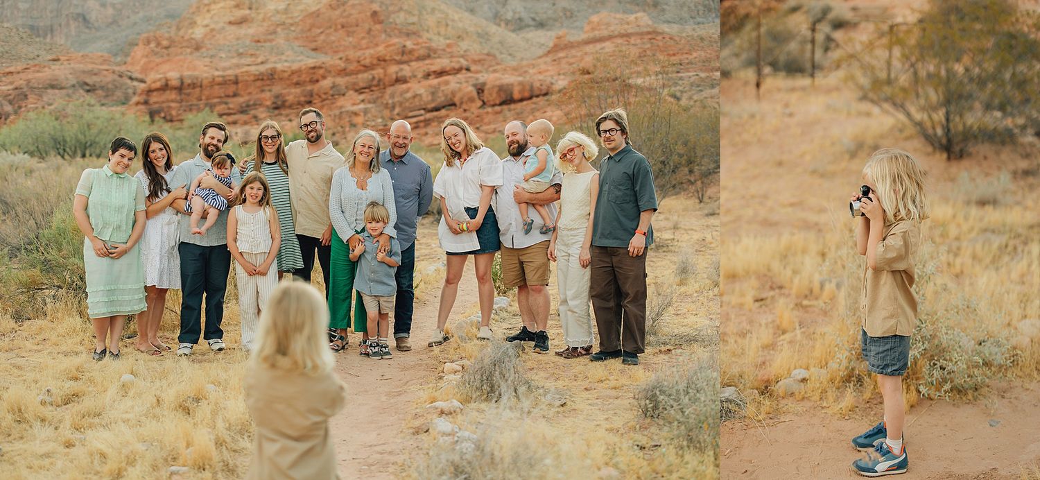 Large family group posing together outdoors in a red rock desert landscape for a professional family portrait session.