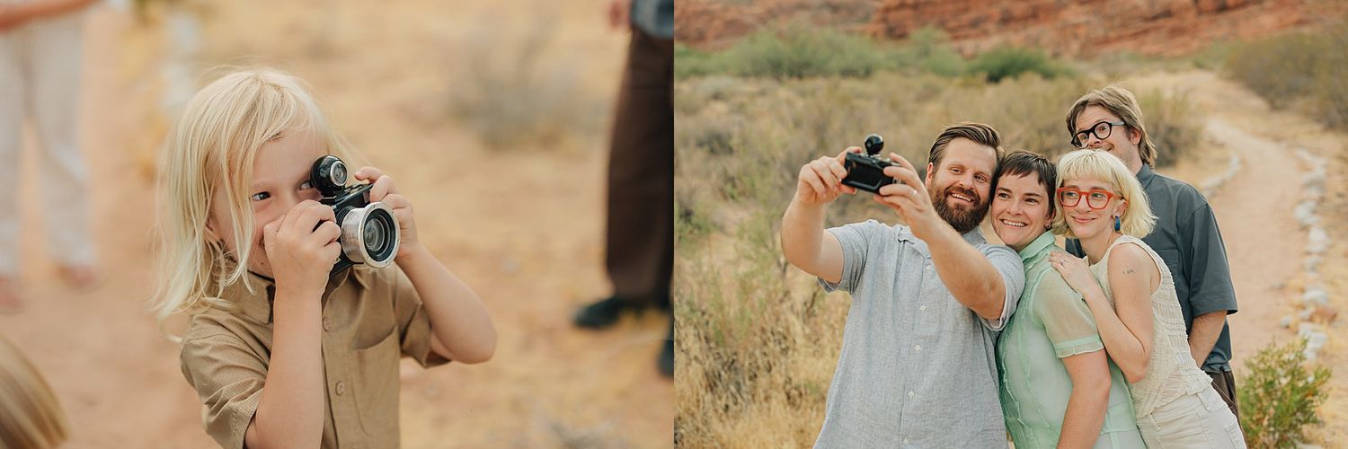 A young child photographs with a camera outdoors, while a group of adults smile and take a selfie in a desert landscape.