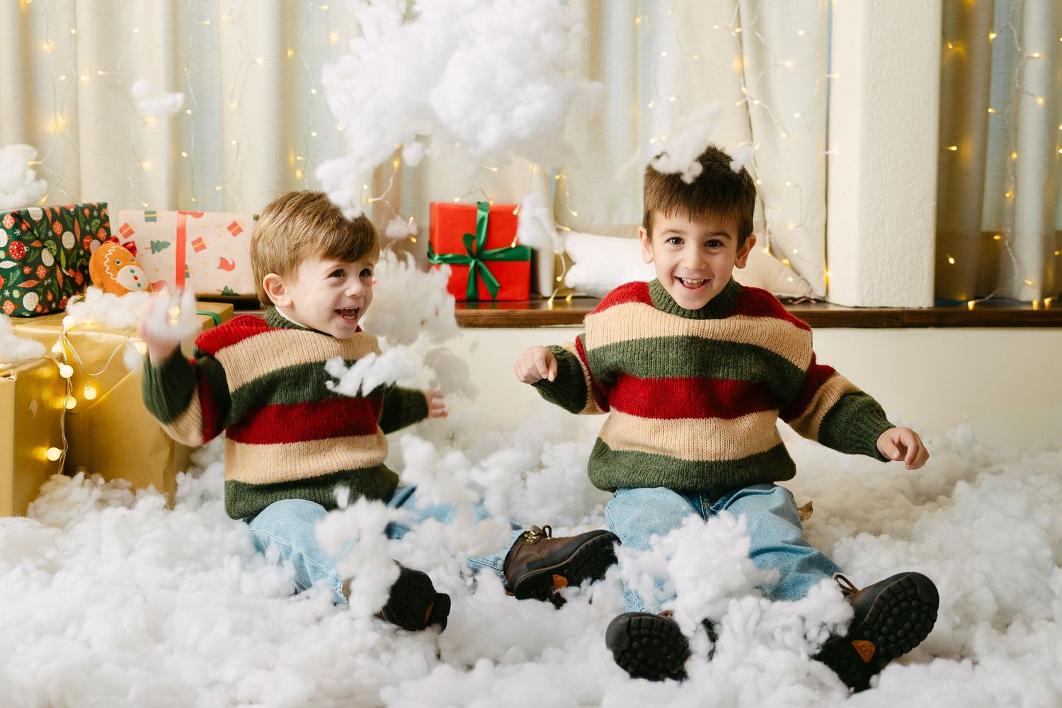 Family relaxes together on couch during intimate holiday photo session.