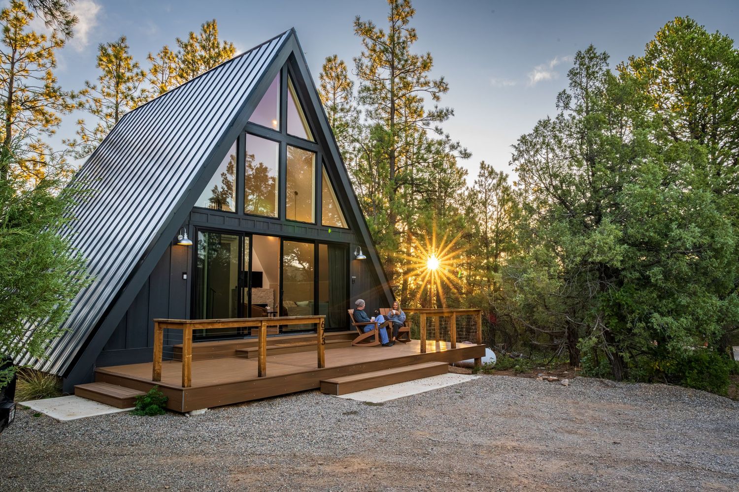 A couple sitting on the front deck of a luxury rental property captured for Durango Dwellings in Durango, CO.