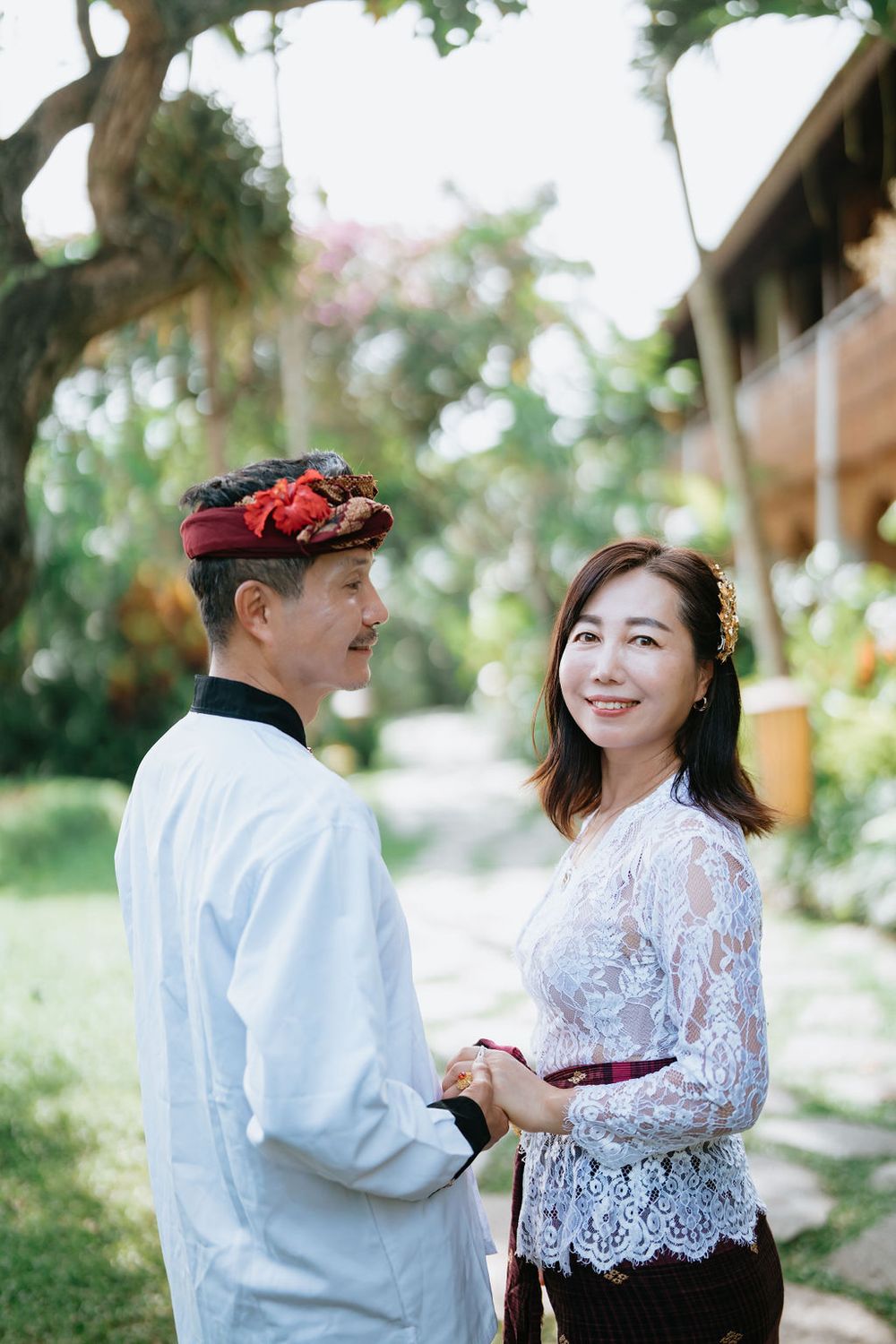 Couple wearing traditional Balinese costumes during a photoshoot at Alaya Ubud.