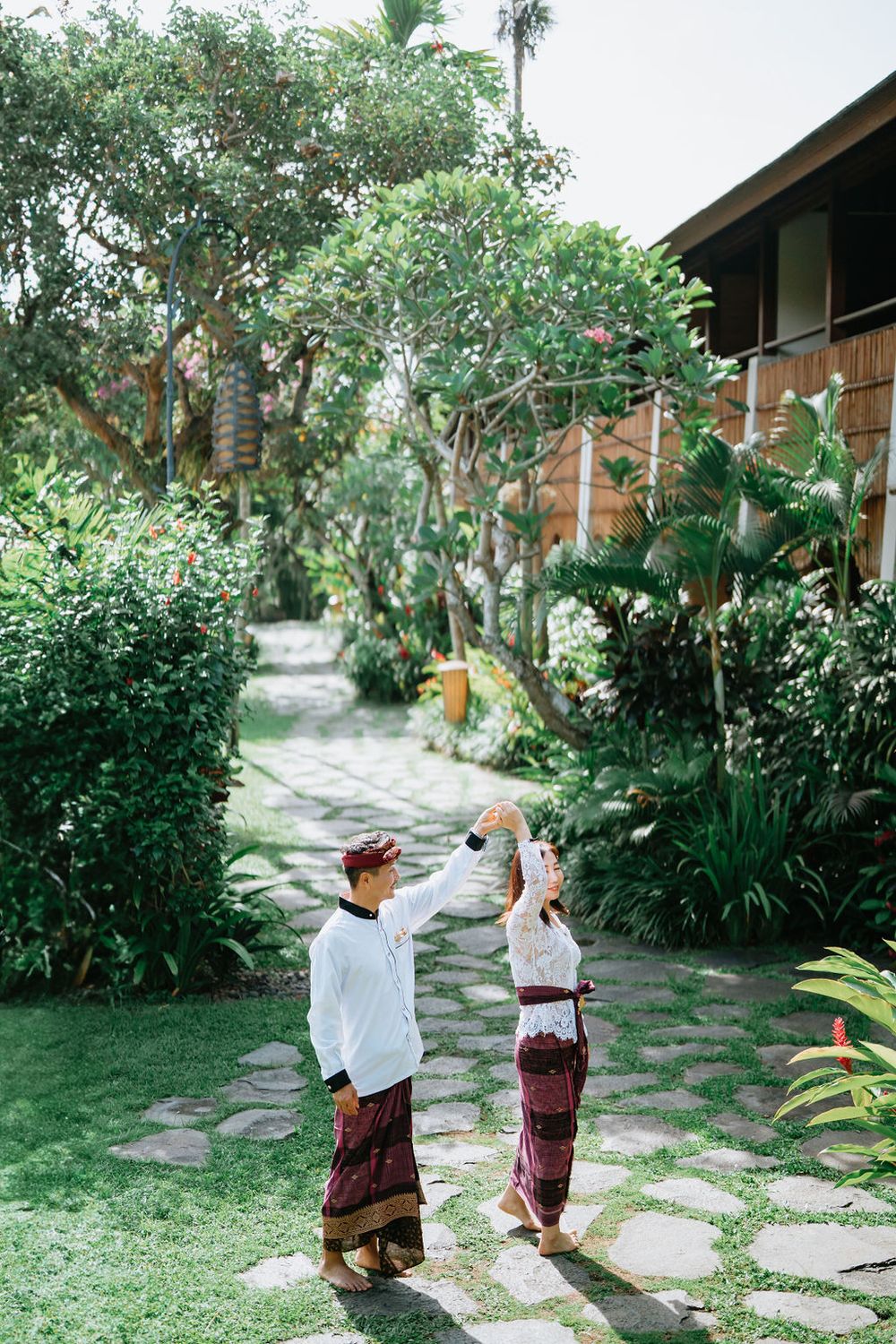 Couple wearing traditional Balinese costumes during a photoshoot at Alaya Ubud.