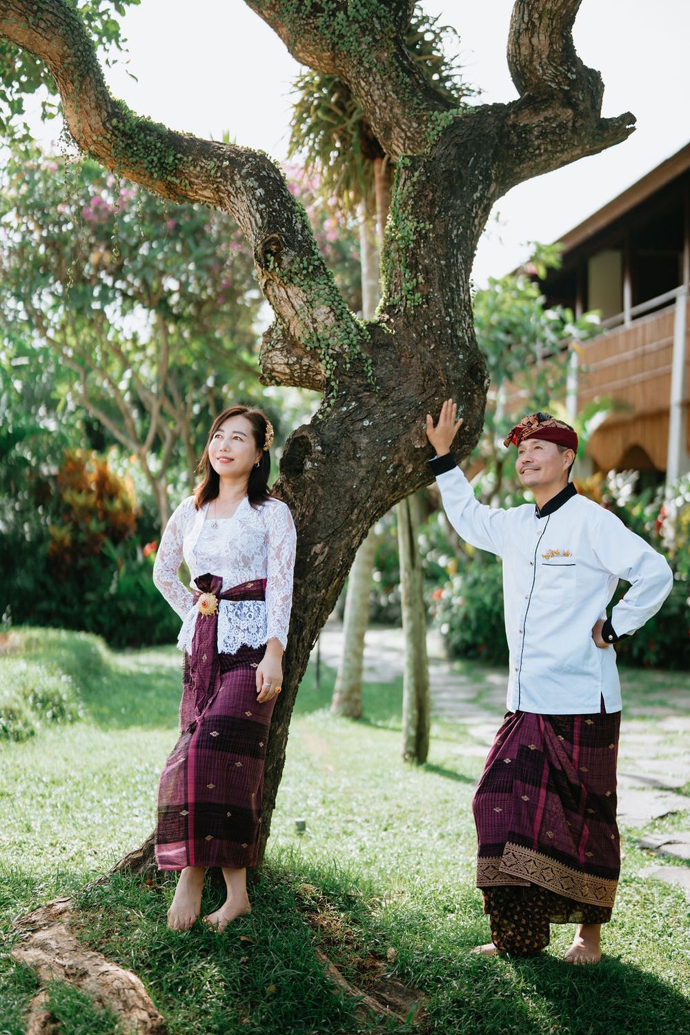 Couple wearing traditional Balinese costumes during a photoshoot at Alaya Ubud.